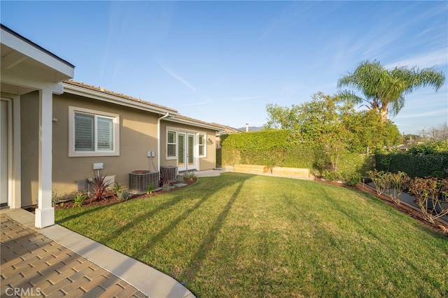 view of yard featuring french doors