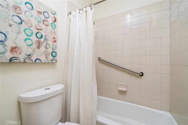 bathroom featuring toilet and shower / bath combo with shower curtain