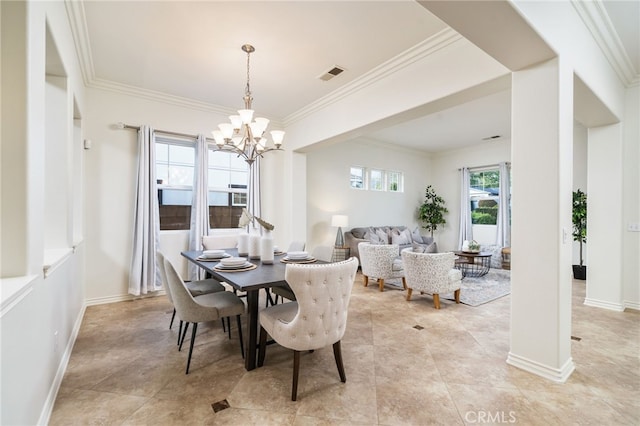 dining area with crown molding, visible vents, a notable chandelier, and baseboards