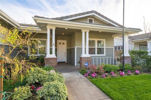 doorway to property featuring covered porch