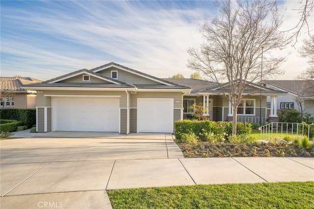 view of front facade with a garage and concrete driveway