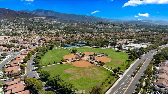 drone / aerial view featuring a residential view and a mountain view