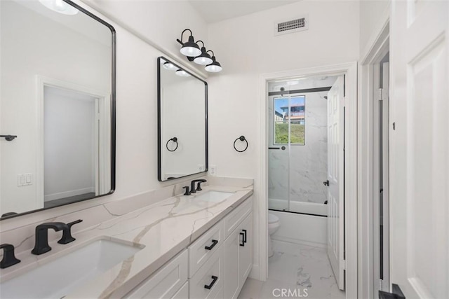 full bath with toilet, marble finish floor, visible vents, and a sink