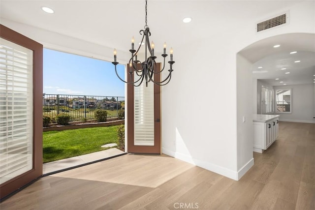 entrance foyer featuring recessed lighting, visible vents, plenty of natural light, and light wood finished floors