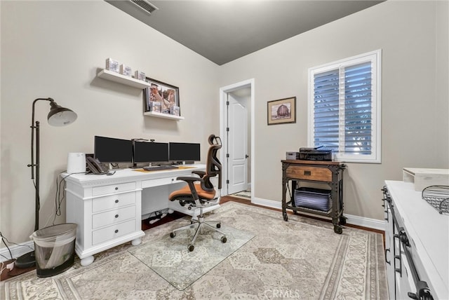 office featuring visible vents and baseboards