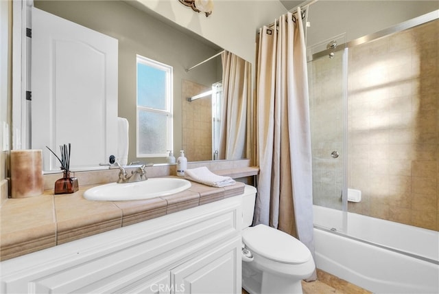 bathroom with toilet, shower / bathtub combination with curtain, and vanity