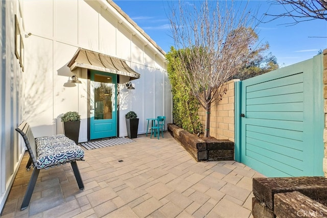 view of patio featuring fence