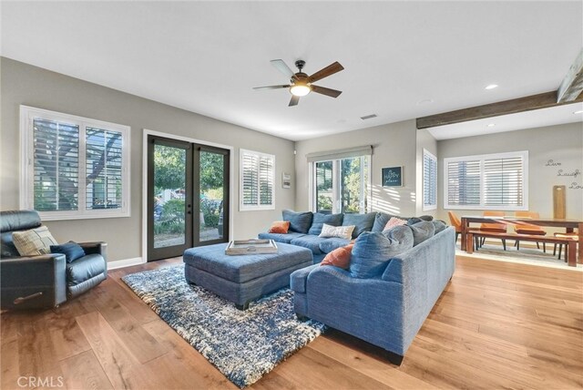 living area with recessed lighting, visible vents, baseboards, french doors, and light wood finished floors