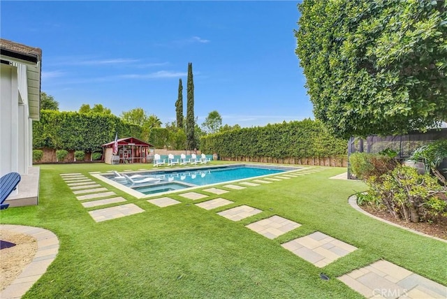 view of pool with a lawn, a fenced backyard, and a pool with connected hot tub