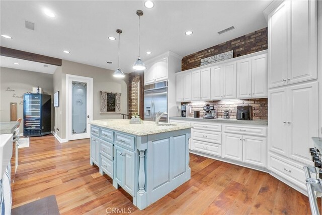 2480 Oak Ave, Corona, CA 92882 - kitchen featuring built in fridge, white cabinets, a sink, decorative backsplash, and recessed lighting