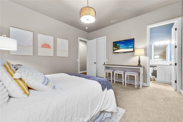 2480 Oak Ave, Corona, CA 92882 - carpeted bedroom featuring ensuite bath and baseboards