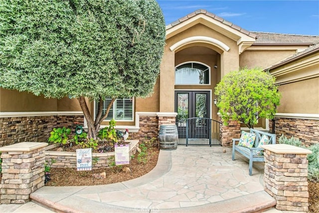 2480 Oak Ave, Corona, CA 92882 - property entrance with stucco siding, stone siding, and french doors
