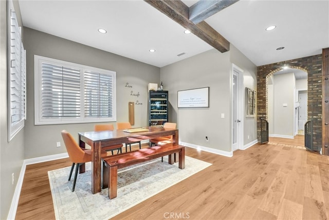 2480 Oak Ave, Corona, CA 92882 - dining room featuring light wood-style floors, baseboards, arched walkways, beamed ceiling, and recessed lighting