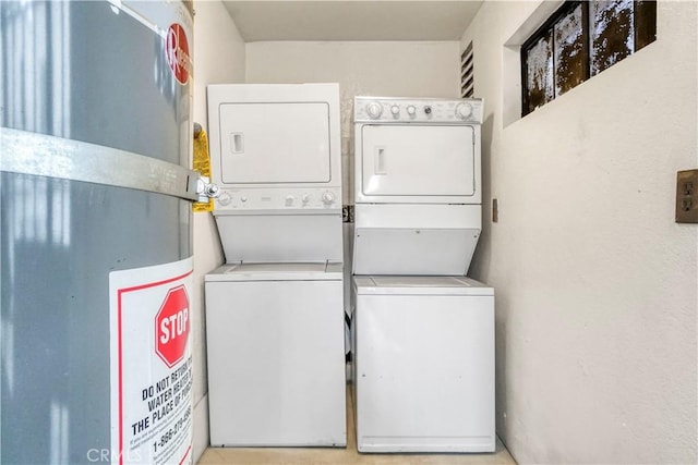 washroom with laundry area and stacked washer / drying machine