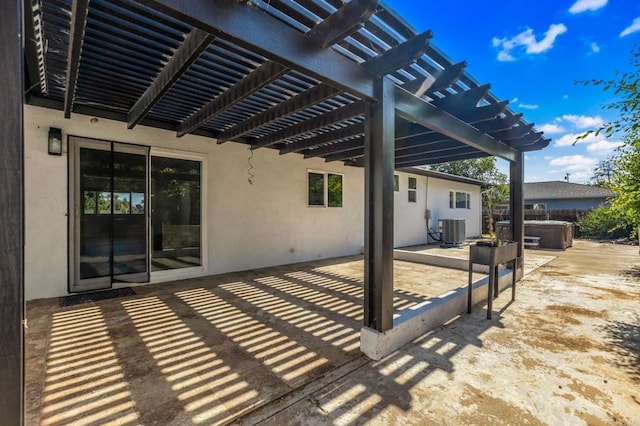 view of patio / terrace with central AC unit and a pergola