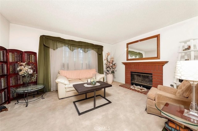 living area featuring carpet, a fireplace, and a textured ceiling