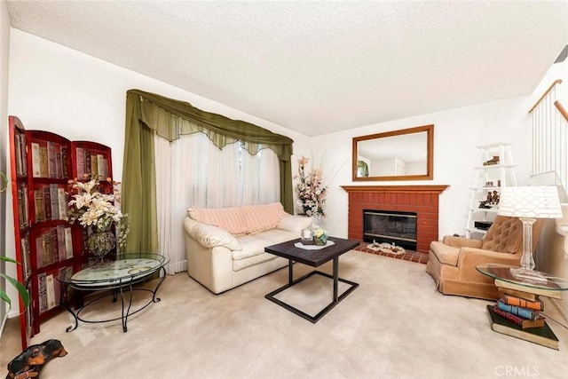 carpeted living area with a brick fireplace and a textured ceiling