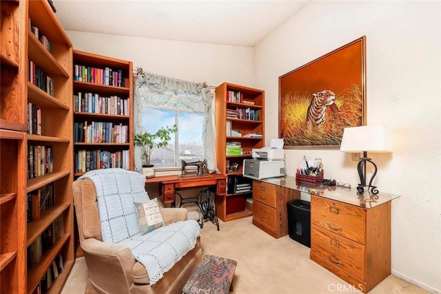 office space with lofted ceiling and light carpet