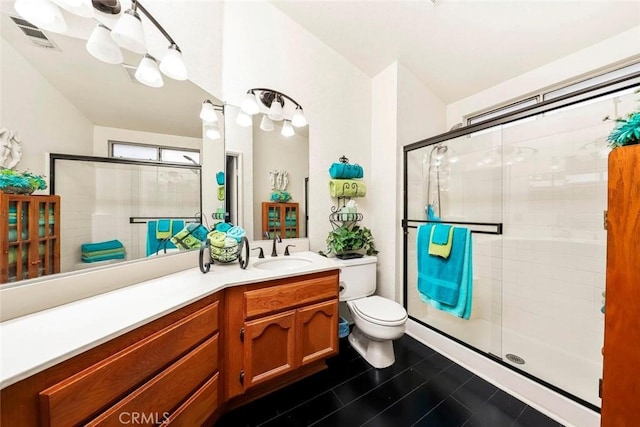 full bathroom with visible vents, a stall shower, vanity, and toilet