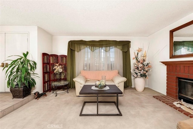 carpeted living area with a textured ceiling and a brick fireplace