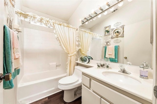 full bathroom featuring toilet, wood finished floors, vanity, visible vents, and shower / bath combination with curtain