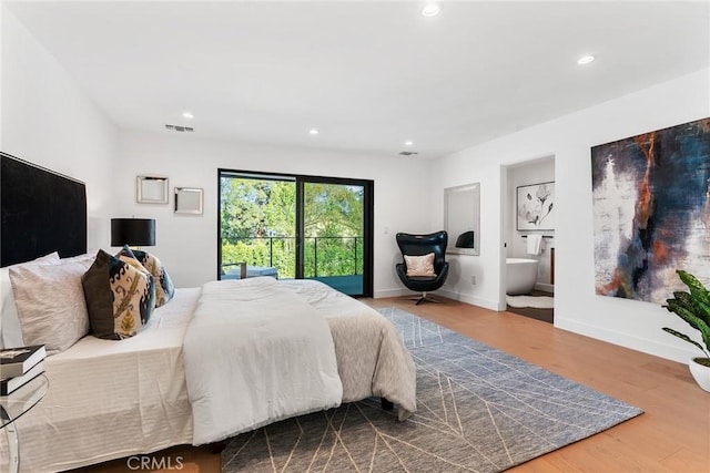 bedroom featuring visible vents, wood finished floors, baseboards, connected bathroom, and recessed lighting