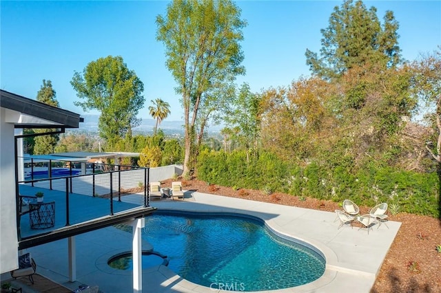 outdoor pool featuring a patio