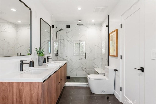 bathroom featuring tile patterned flooring, toilet, a sink, and a marble finish shower