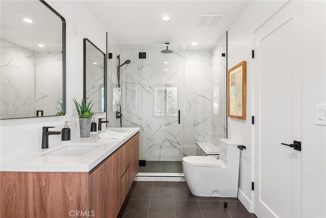 full bathroom with a sink, a marble finish shower, tile patterned flooring, and toilet
