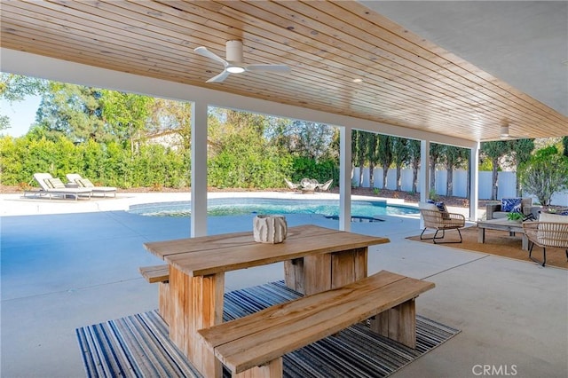 view of patio with a fenced in pool, a ceiling fan, and a fenced backyard
