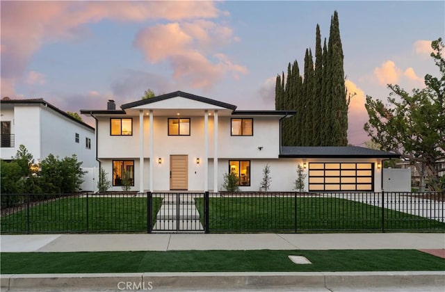 view of front of property with a fenced front yard, an attached garage, stucco siding, a chimney, and a front yard