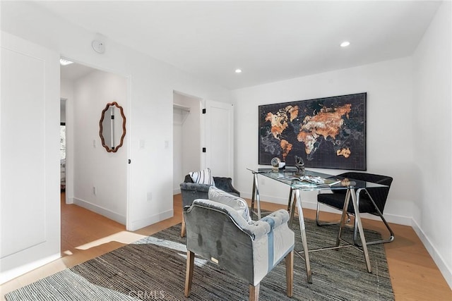 home office with recessed lighting, baseboards, and light wood finished floors