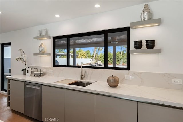 kitchen featuring a sink, modern cabinets, open shelves, and dishwasher