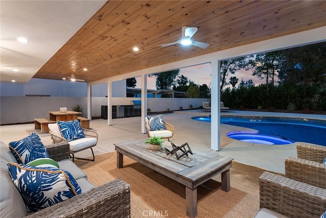 interior space featuring a fenced in pool, outdoor lounge area, a hot tub, a ceiling fan, and fence