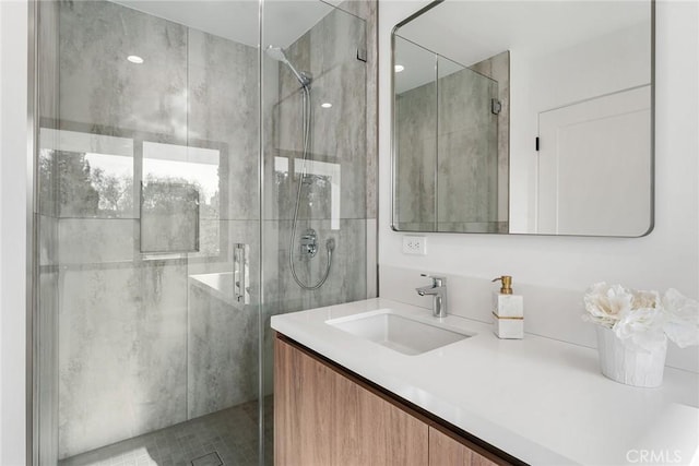 full bath featuring a shower stall and vanity