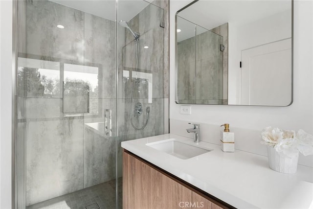 full bath featuring vanity and a shower stall