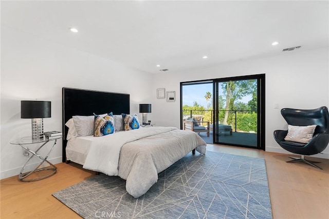 bedroom featuring baseboards, visible vents, wood finished floors, access to outside, and recessed lighting