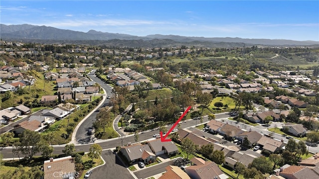 birds eye view of property featuring a mountain view and a residential view