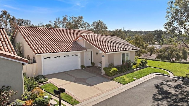 view of front of house with a garage, concrete driveway, a tile roof, and stucco siding