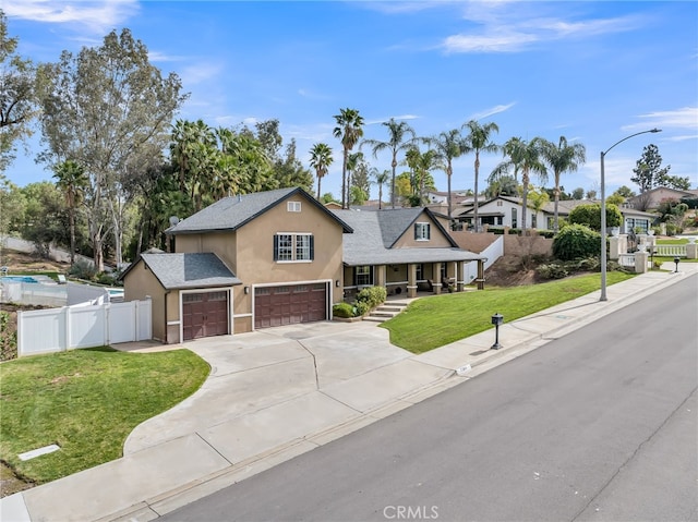 7384 Golden Star Ave, Riverside, CA 92506 - view of front of house with stucco siding, covered porch, concrete driveway, a front yard, and fence
