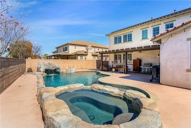 view of pool with a pool with connected hot tub, a fenced backyard, a patio, and grilling area