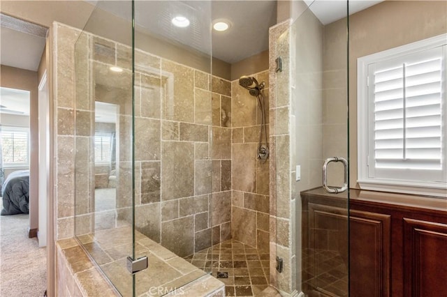 full bath featuring recessed lighting, connected bathroom, and a shower stall