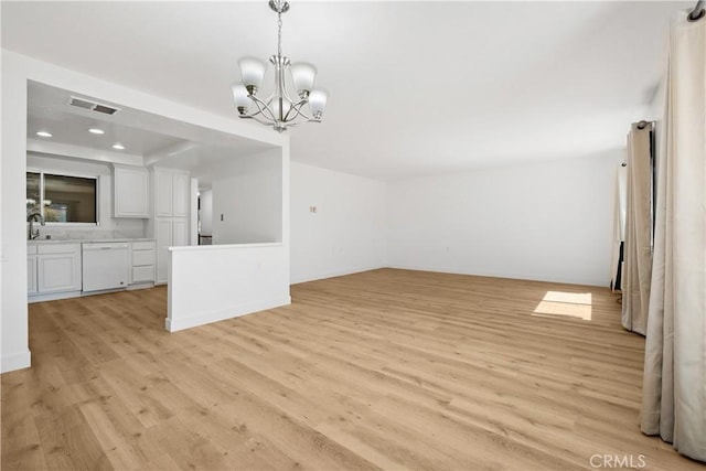 4012 Calle Sonora Oeste Unit 1B, Laguna Woods, CA 92637 - unfurnished living room with light wood-style floors, a chandelier, and recessed lighting