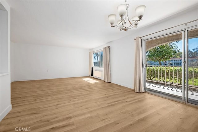 4012 Calle Sonora Oeste Unit 1B, Laguna Woods, CA 92637 - spare room featuring a chandelier and light wood-style floors