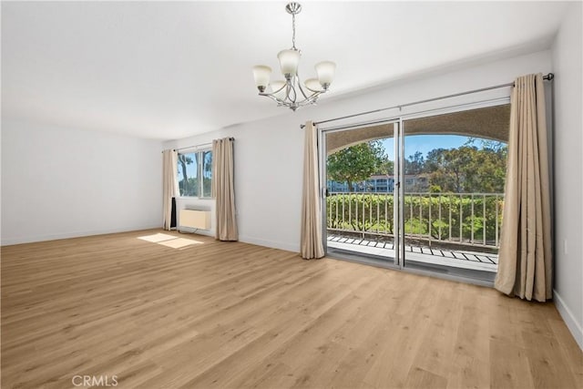 4012 Calle Sonora Oeste Unit 1B, Laguna Woods, CA 92637 - unfurnished room featuring a chandelier and light wood-type flooring