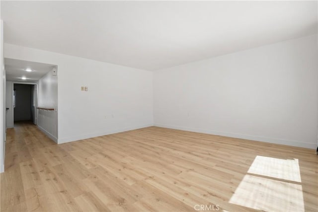 4012 Calle Sonora Oeste Unit 1B, Laguna Woods, CA 92637 - empty room with light wood-style floors and baseboards