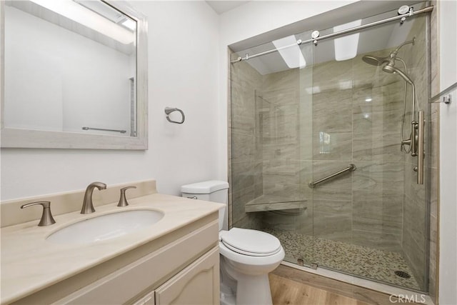 4012 Calle Sonora Oeste Unit 1B, Laguna Woods, CA 92637 - full bathroom with a shower stall, vanity, and wood finished floors