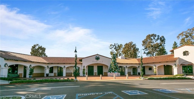 view of property featuring uncovered parking