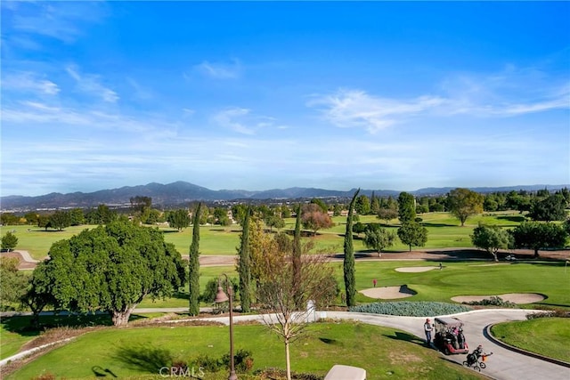 4012 Calle Sonora Oeste Unit 1B, Laguna Woods, CA 92637 - surrounding community with a mountain view, golf course view, and a yard