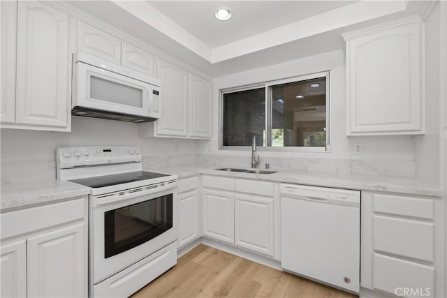 4012 Calle Sonora Oeste Unit 1B, Laguna Woods, CA 92637 - kitchen with white appliances, white cabinets, light wood finished floors, recessed lighting, and light stone countertops